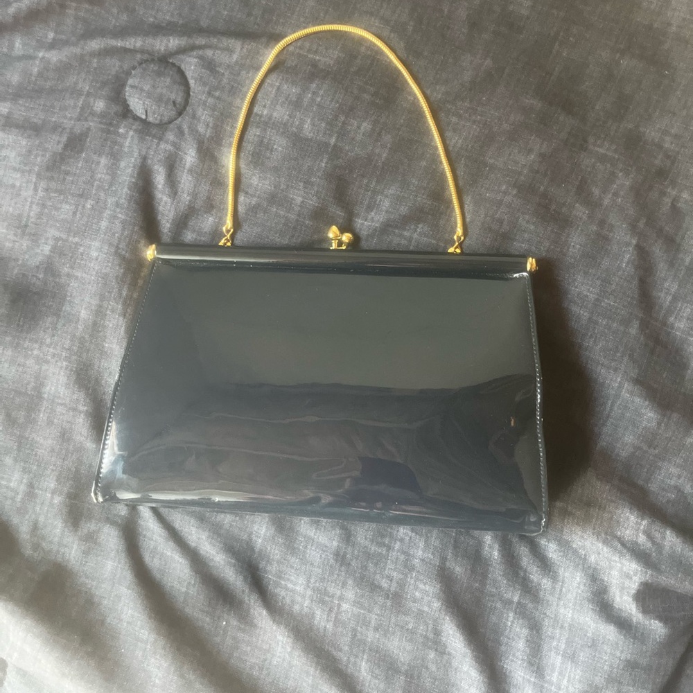 Elegant Black Handbag with Gold Handle